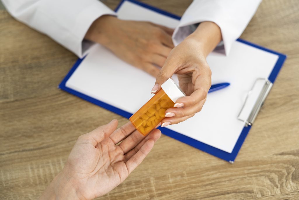 high angle people holding a pills scaled